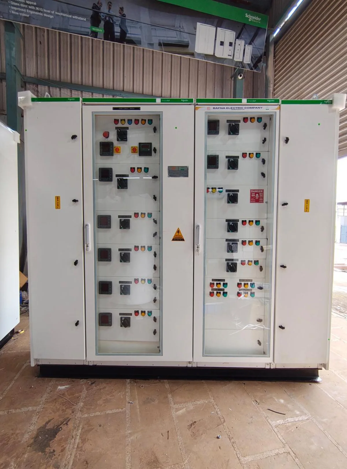 Multi-section electrical control panel assembly in the Bafna Electric workshop